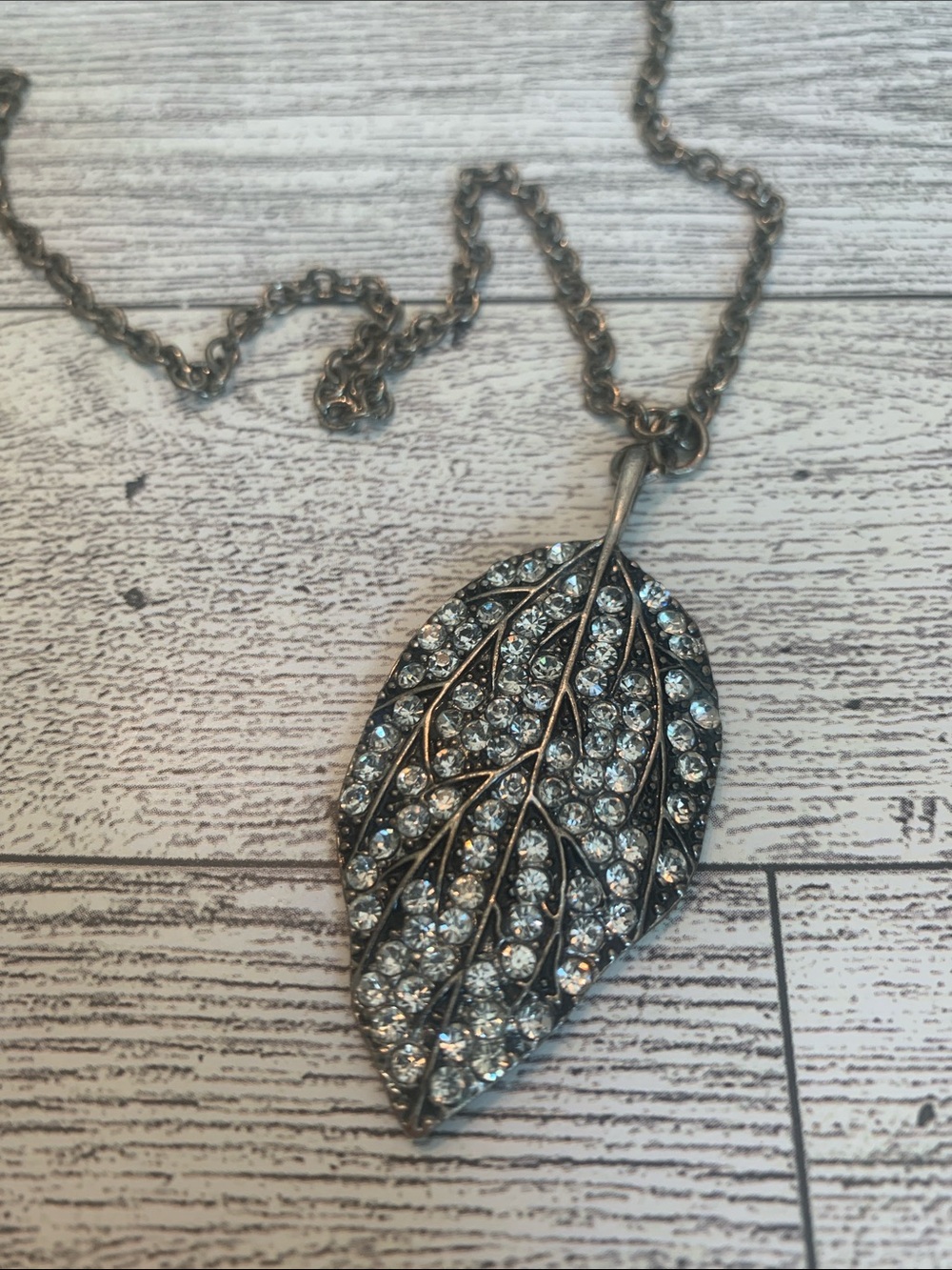 Crystal embedded leaf pendant on 30 inch chain